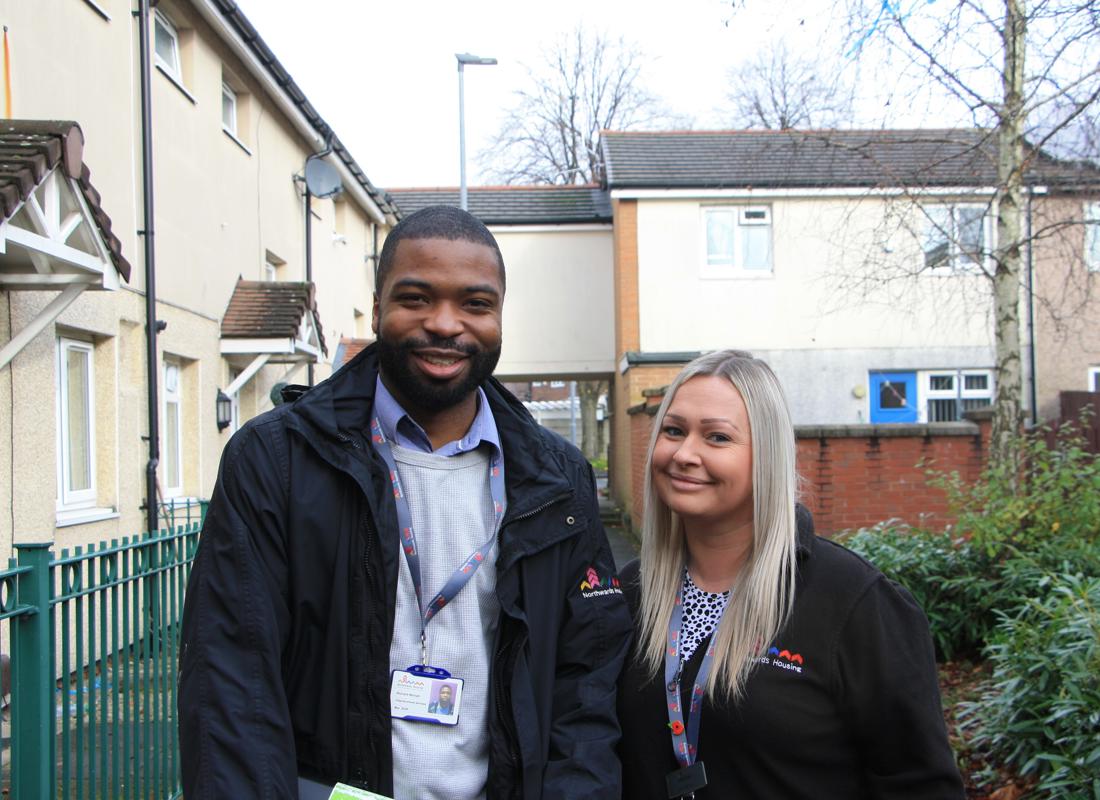 two neighbourhood Housing Officers On An Estate Walkabout