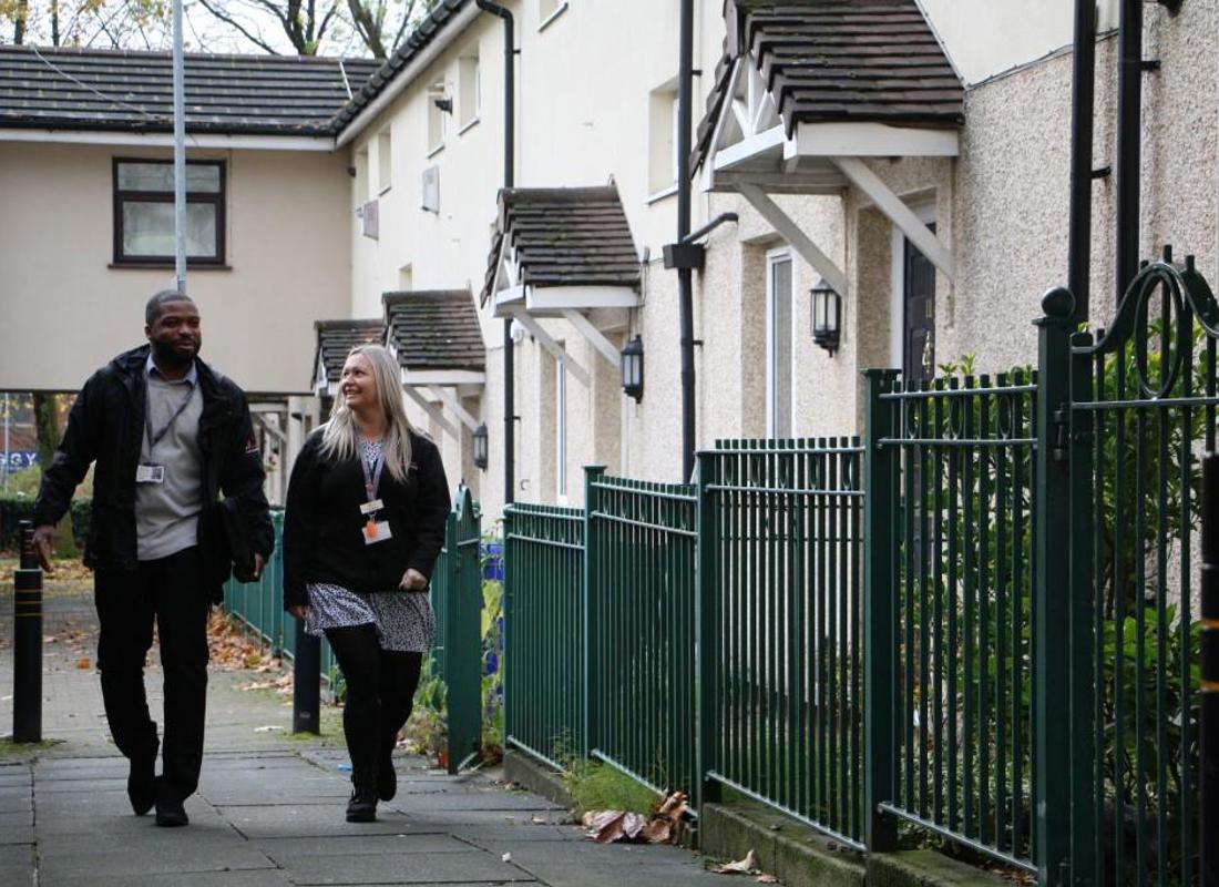 Neighbourhood Housing Officers On An Estate Walkabout