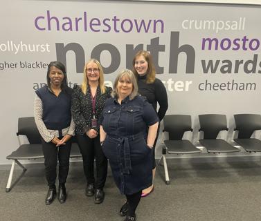 the money matters team posing for a photo in reception